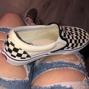 White and black checkered vans.